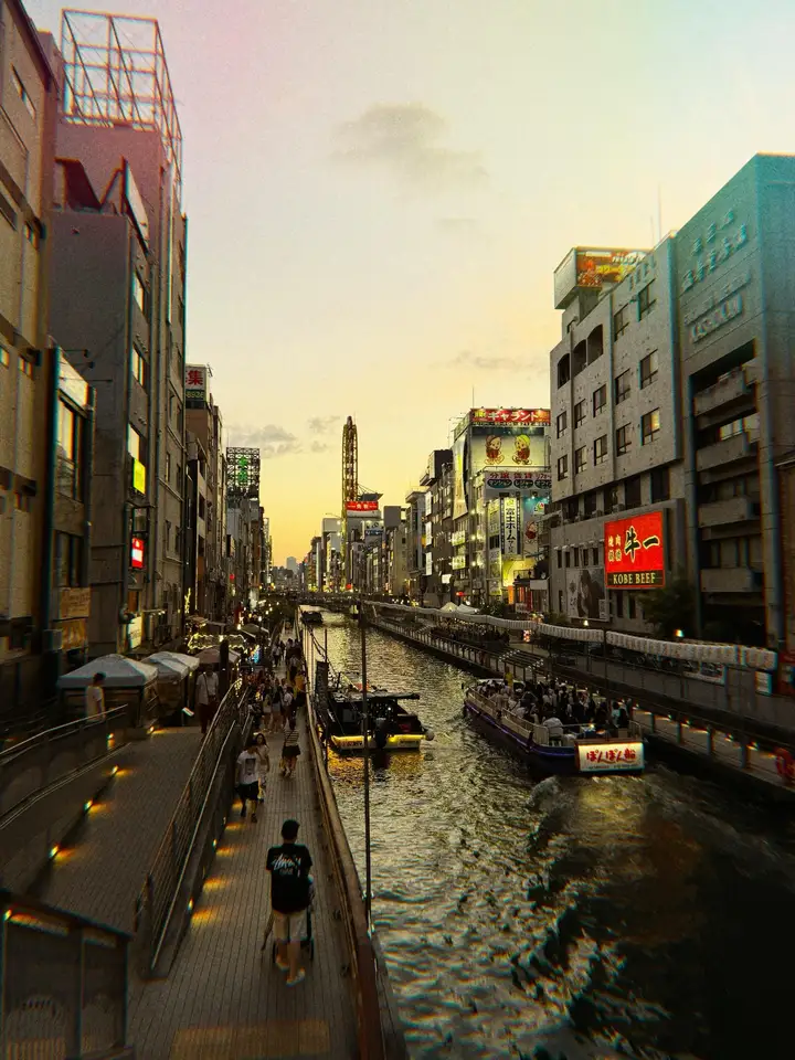 Sunset above a canal running between city buildings